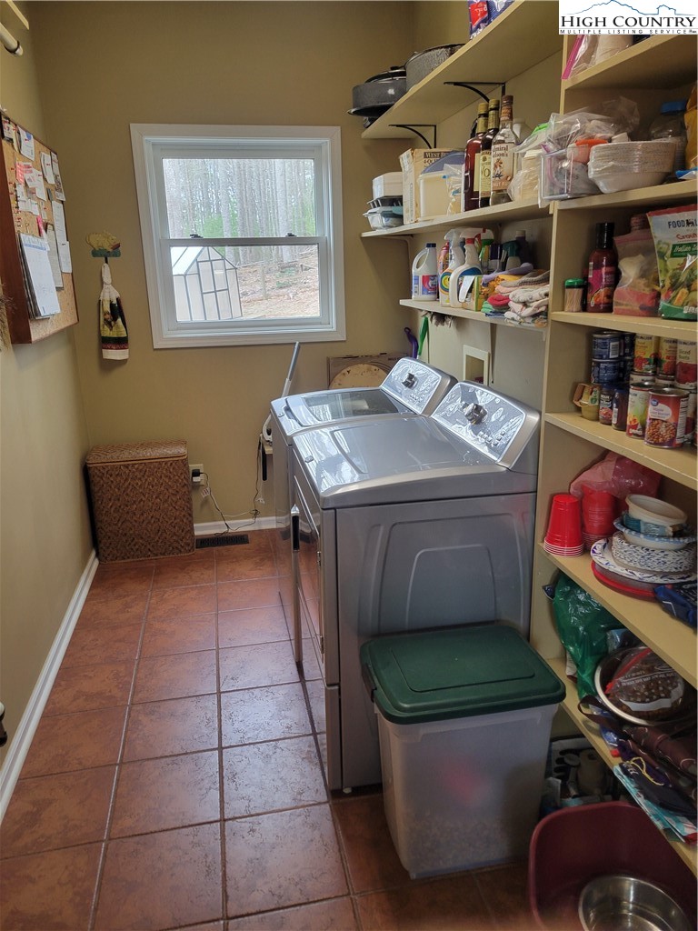 1729 Cranberry Creek Road Laurel Springs, NC 28644 - Photo 8 of 26 a utility room with washer and dryer