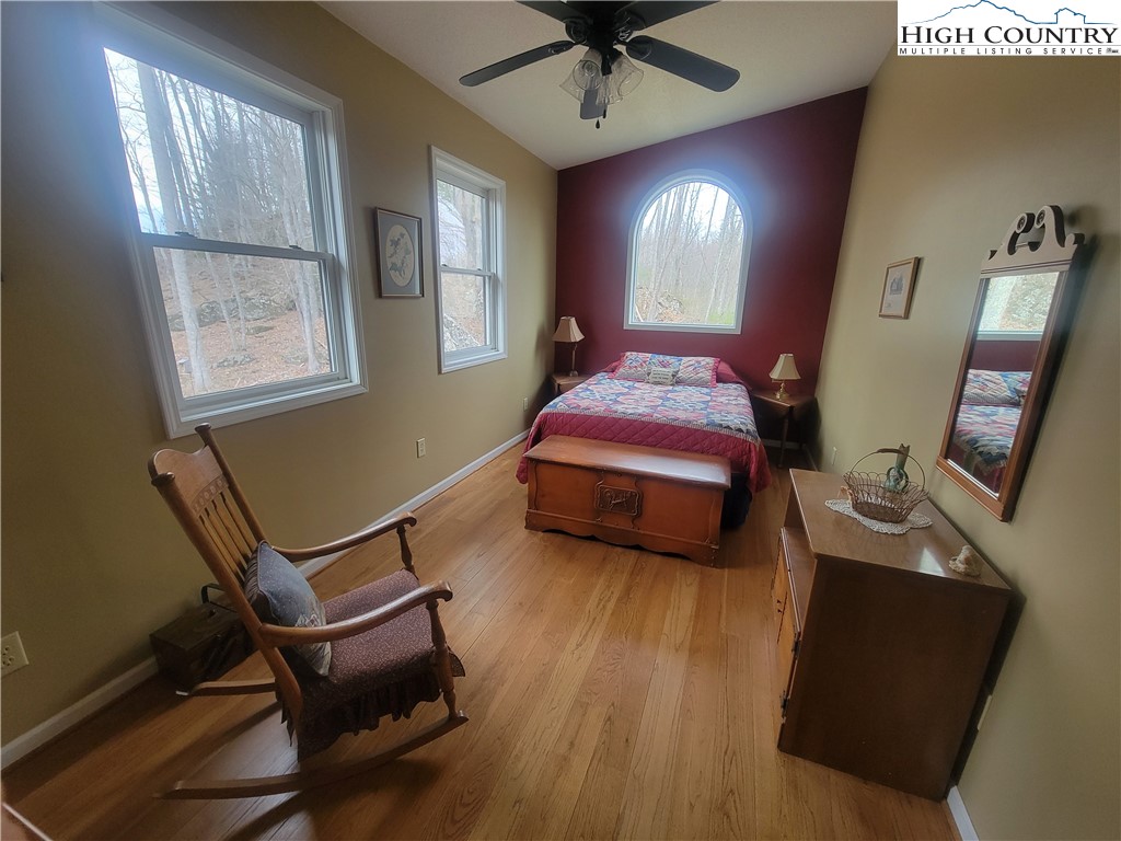 1729 Cranberry Creek Road Laurel Springs, NC 28644 - Photo 10 of 26 a bedroom with a bed window and bed