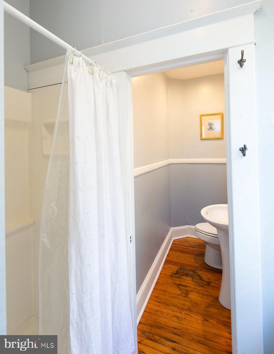 606 Locust Street Cambridge, MD 21613 - Photo 17 of 37 a bathroom with a sink and a toilet