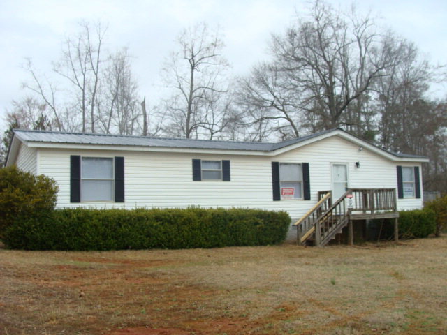 127 Morris Road Gray, GA 31032 - Photo 1 of 15 a view of a house with a backyard and plants