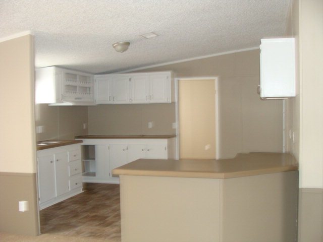 127 Morris Road Gray, GA 31032 - Photo 2 of 15 a kitchen with granite countertop a sink and a stove