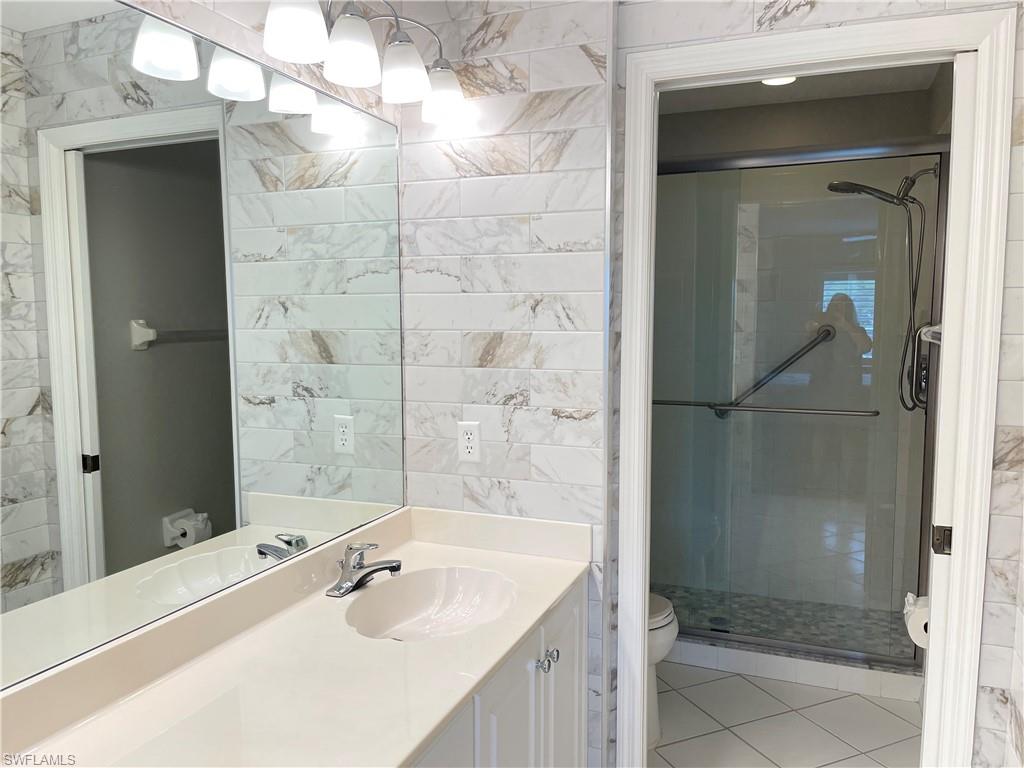 9009 Michael Circle, Unit 1110 Naples, FL 34113 - Photo 18 of 44 Fully remodeled primary bathroom