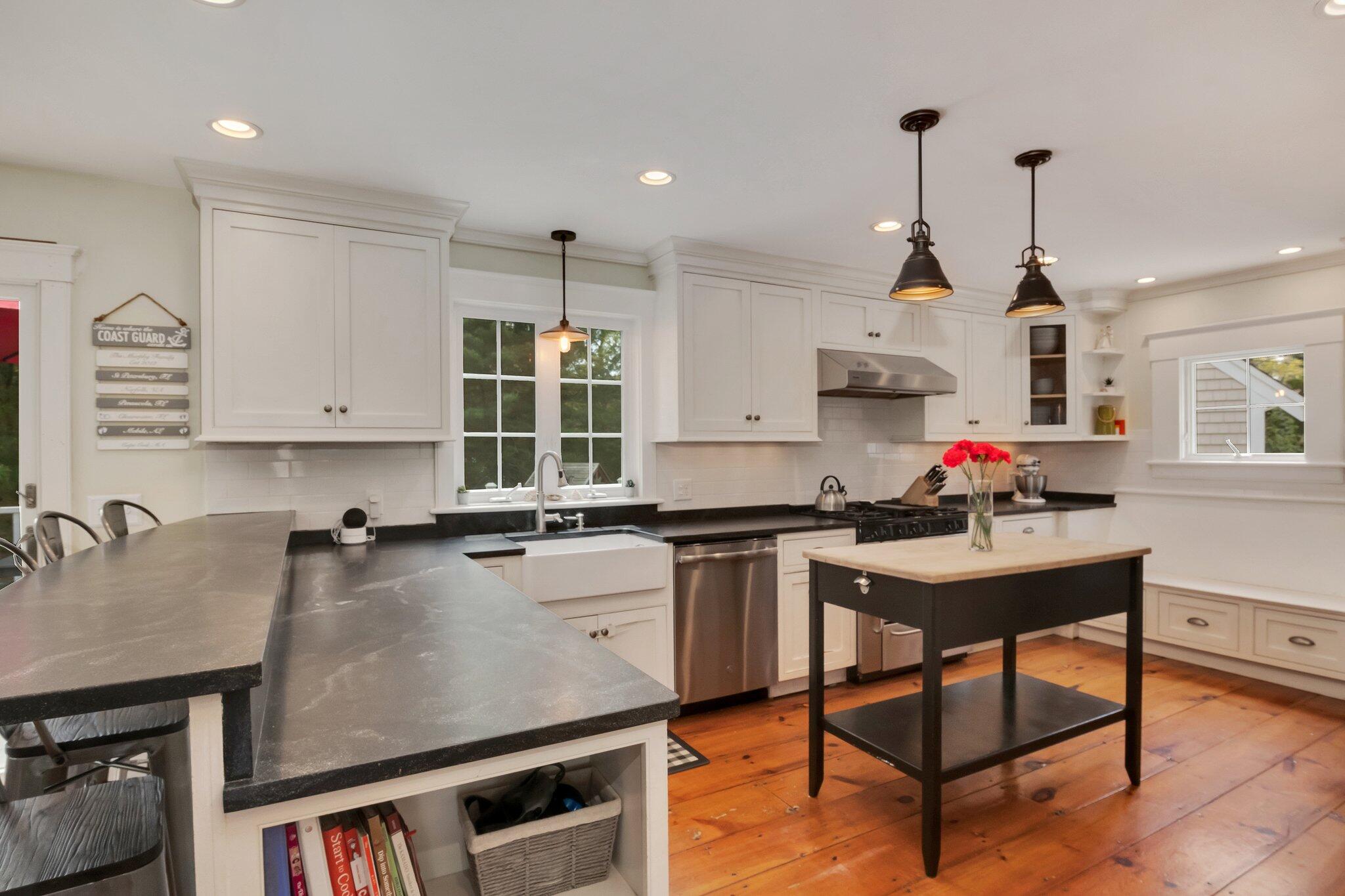 2 Palmer Road East Sandwich, MA 02537 - Photo 14 of 74 a kitchen with kitchen island granite countertop a sink appliances and cabinets