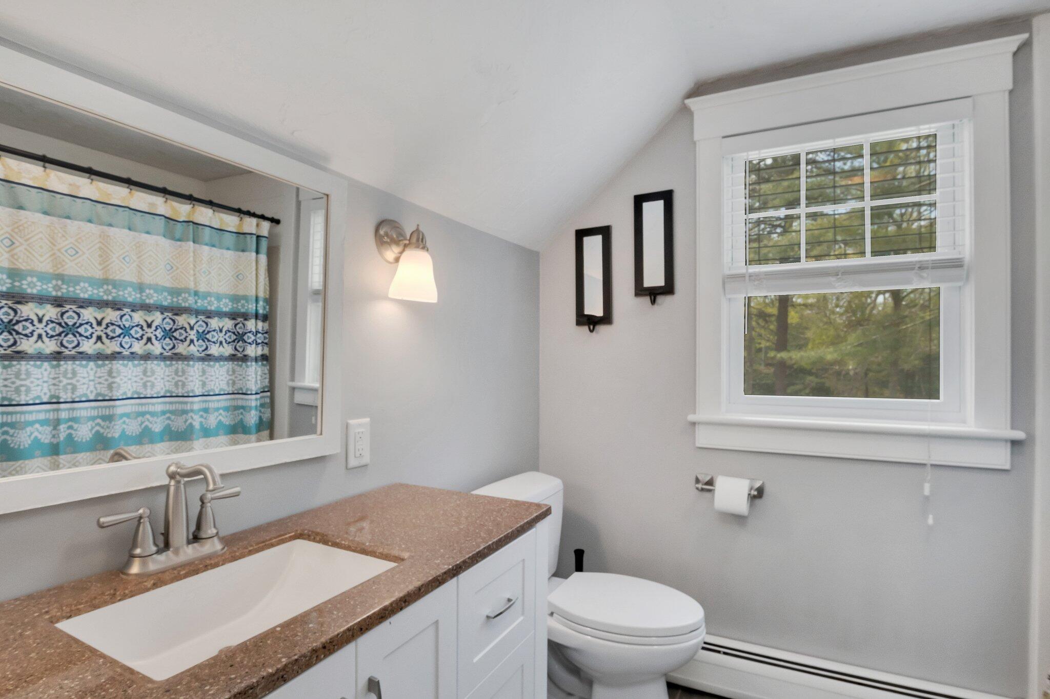 2 Palmer Road East Sandwich, MA 02537 - Photo 29 of 74 a bathroom with a granite countertop sink a toilet and a window