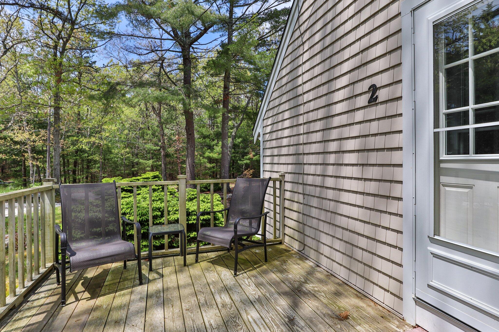 2 Palmer Road East Sandwich, MA 02537 - Photo 41 of 74 a view of a chair and table in the back yard of the house