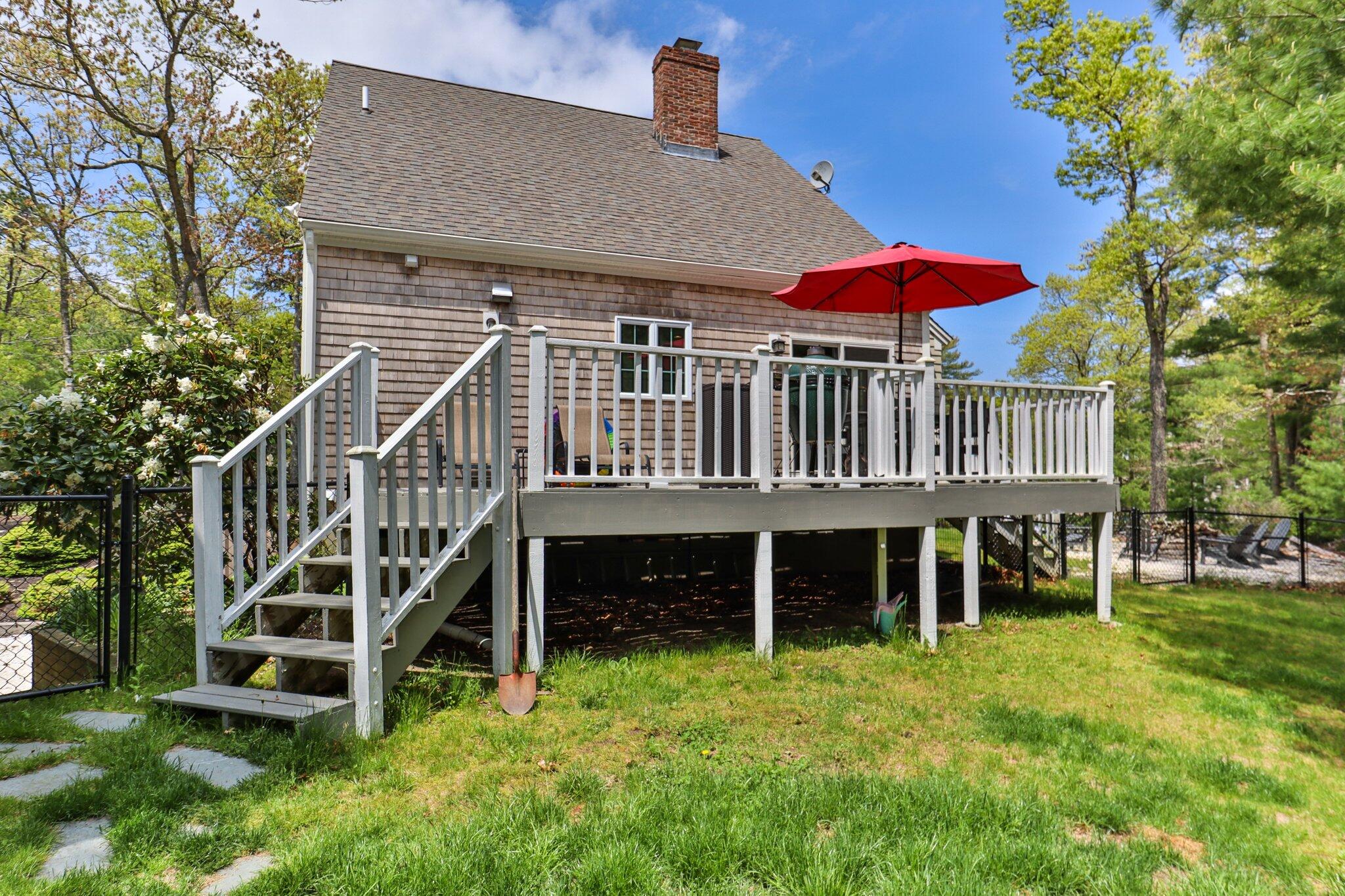 2 Palmer Road East Sandwich, MA 02537 - Photo 60 of 74 a view of a house with a deck and a yard