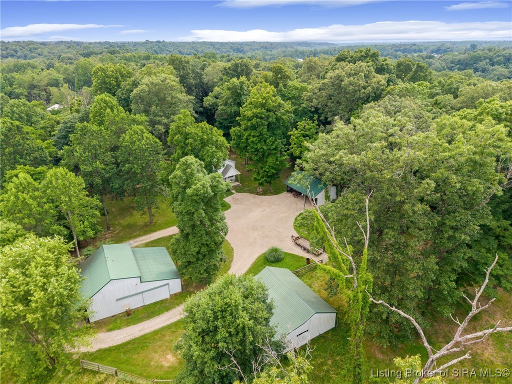 10440 East Saylor Road Salem, IN 47167 - Photo 4 of 57 Pole Barn pictured to the left boasts a back sliding door as well and the the horse barn to the right features two stalls!