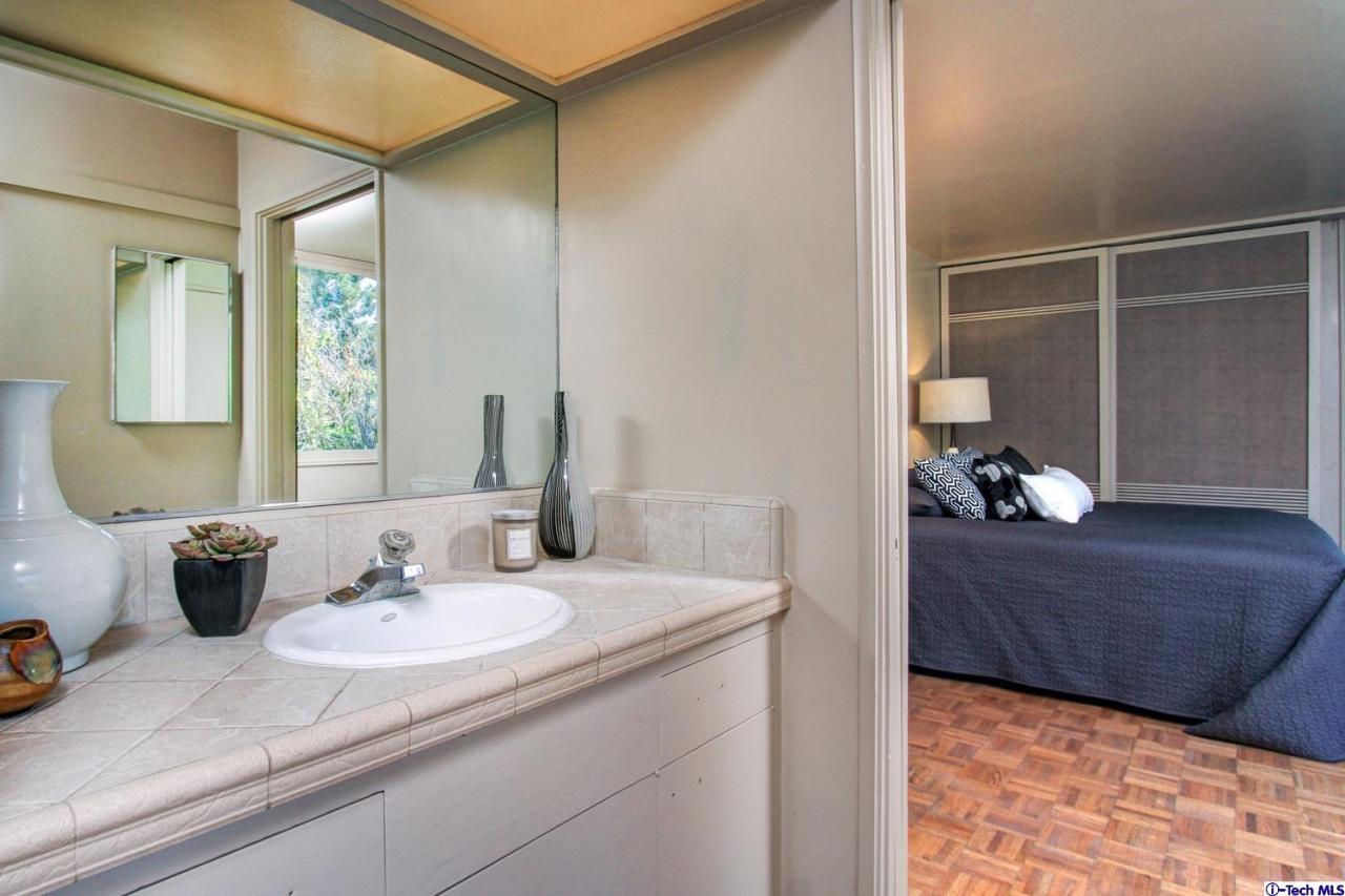 1280 Glen Oaks Boulevard Pasadena, CA 91105 - Photo 21 of 38 a bathroom with a sink and a mirror