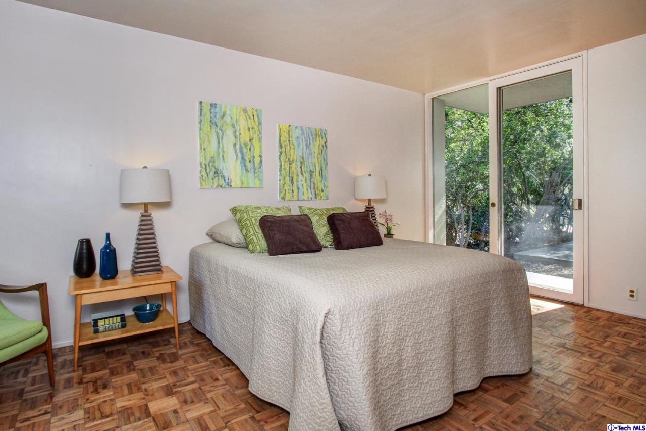 1280 Glen Oaks Boulevard Pasadena, CA 91105 - Photo 24 of 38 a bedroom with a bed and a window