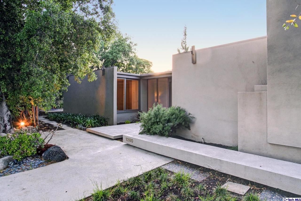 1280 Glen Oaks Boulevard Pasadena, CA 91105 - Photo 4 of 38 a potted plant sitting in front of a house