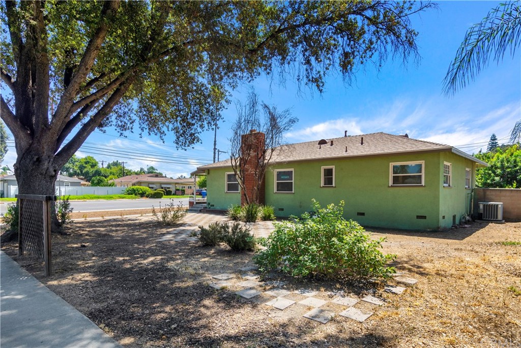 7504 Mt Vernon Street Riverside, CA 92504 - Photo 1 of 1 a view of a house with a yard