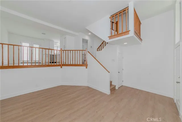 a view of entryway with wooden floor