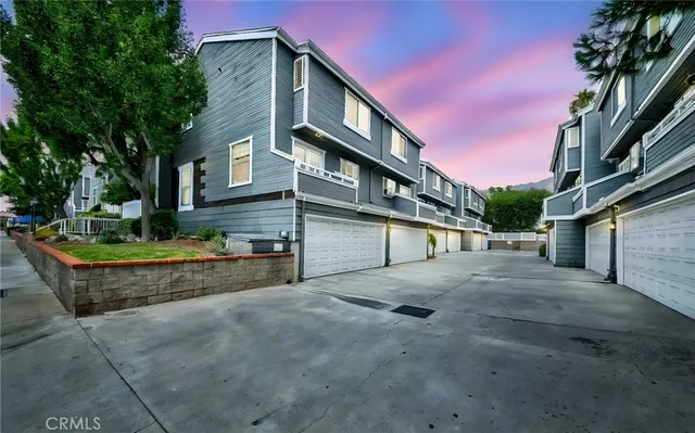 a view of a house with a street