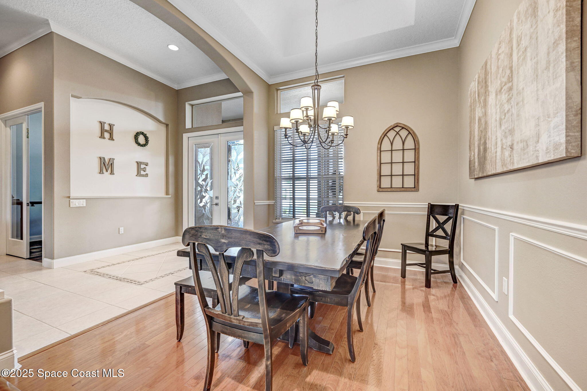 8082 Old Tramway Drive Melbourne, FL 32940 - Photo 11 of 82 a view of a dining room with furniture and chandelier