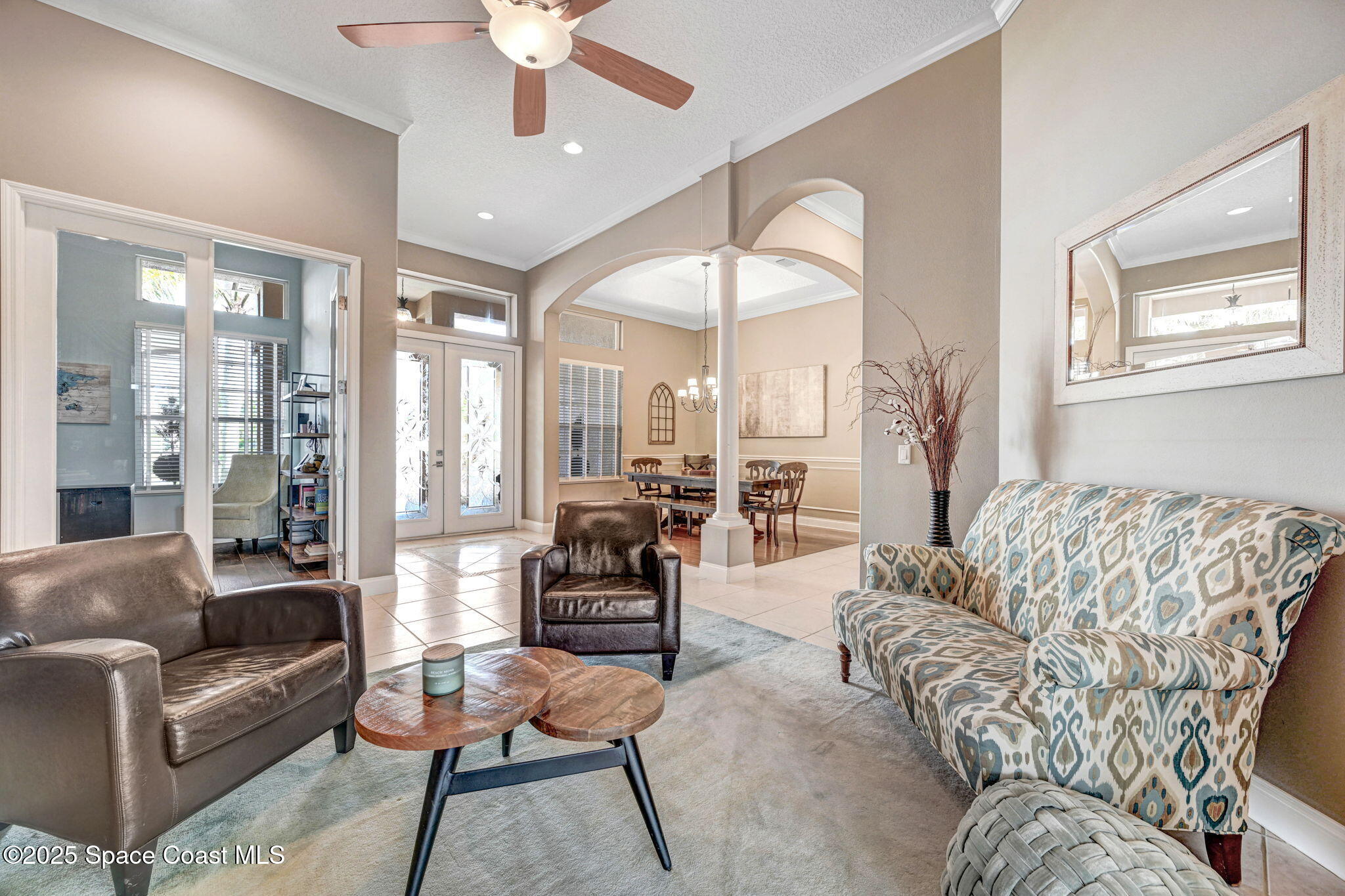 8082 Old Tramway Drive Melbourne, FL 32940 - Photo 15 of 82 a living room with furniture and a large window