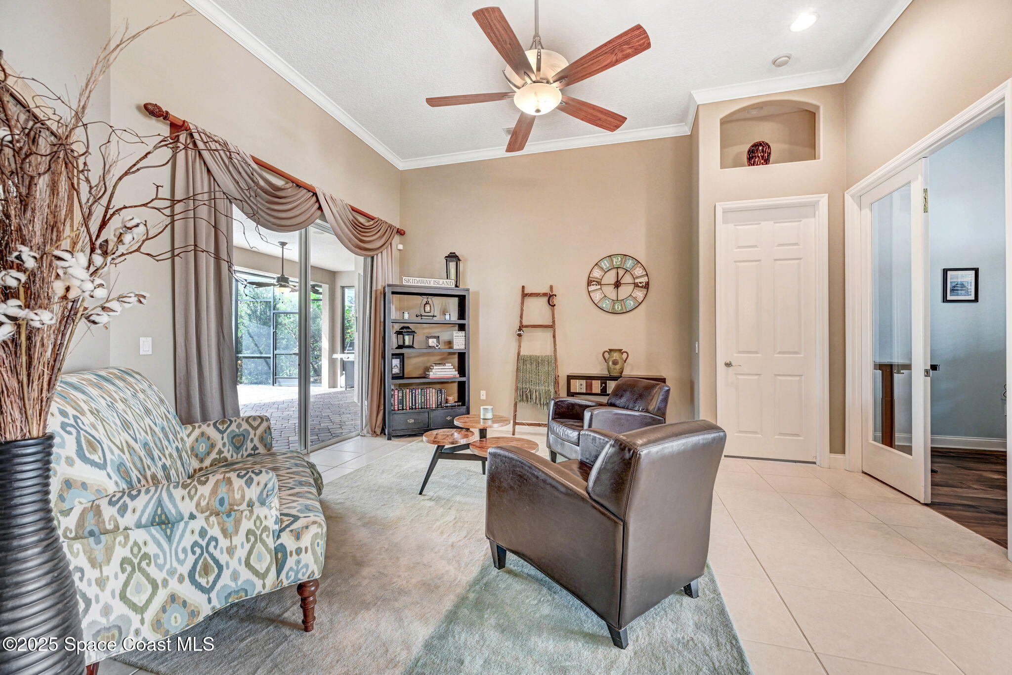 8082 Old Tramway Drive Melbourne, FL 32940 - Photo 17 of 82 a living room with furniture and a large window
