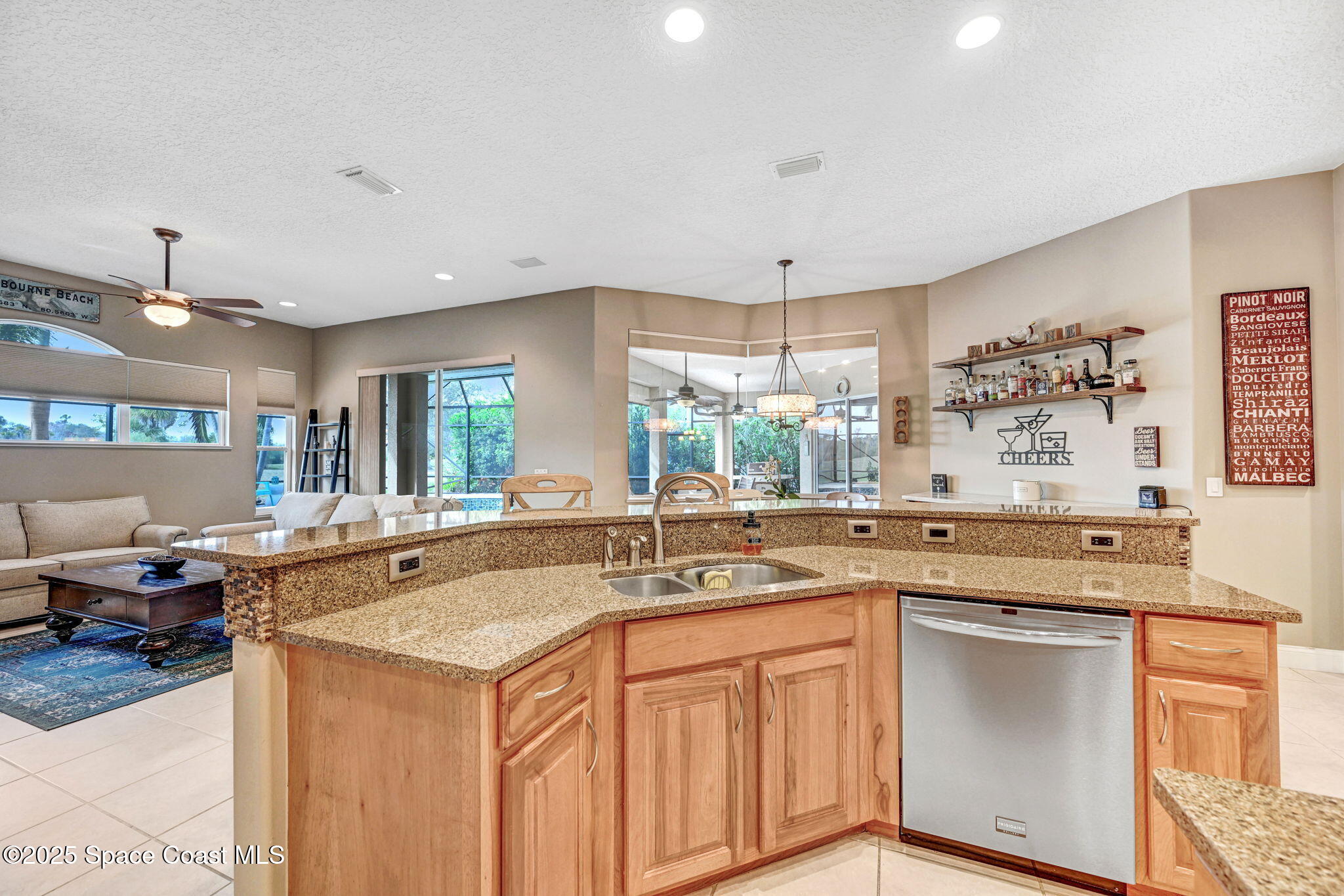 8082 Old Tramway Drive Melbourne, FL 32940 - Photo 26 of 82 a kitchen with granite countertop a sink stove and cabinets