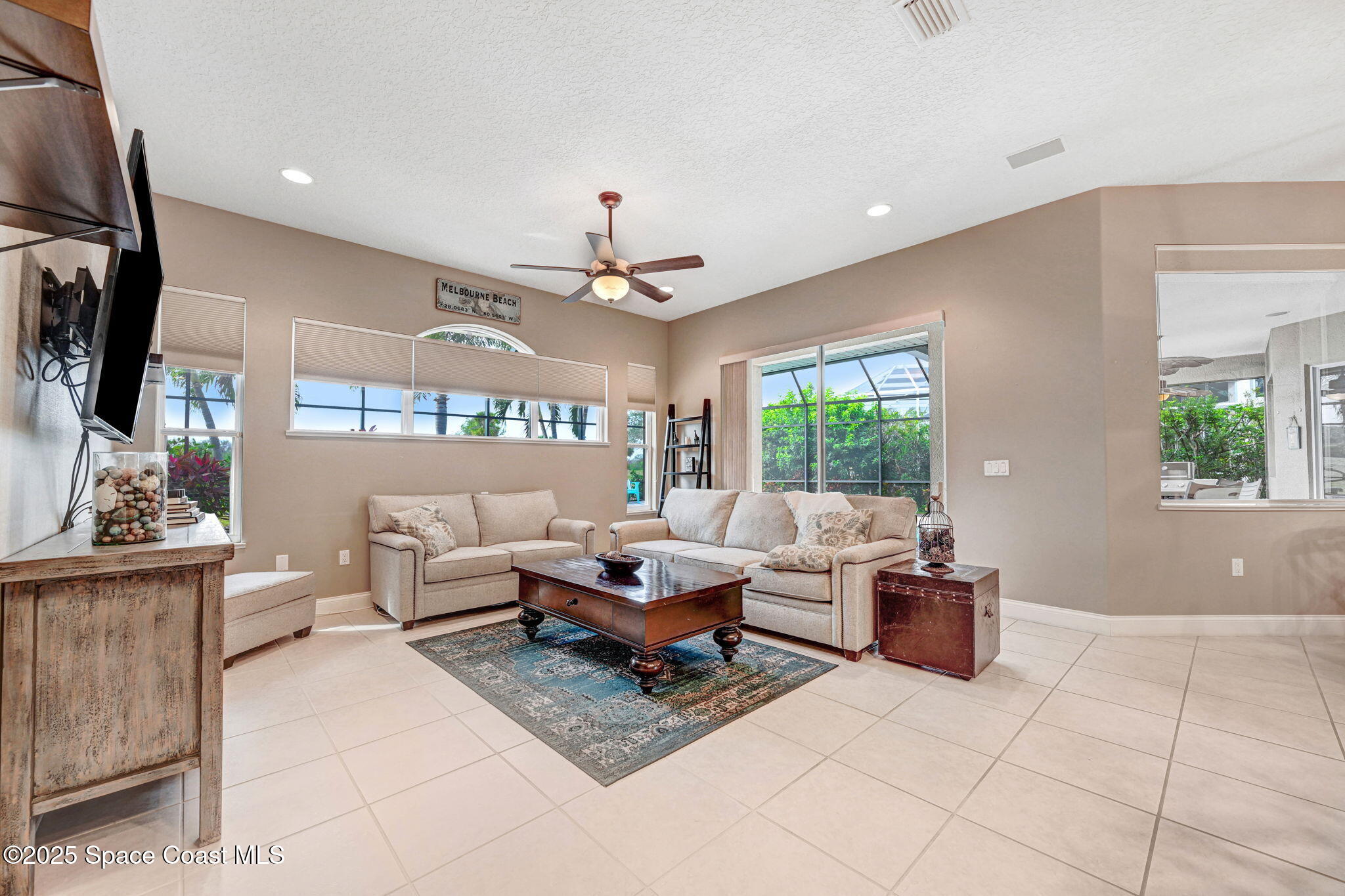 8082 Old Tramway Drive Melbourne, FL 32940 - Photo 27 of 82 a living room with furniture and a large window