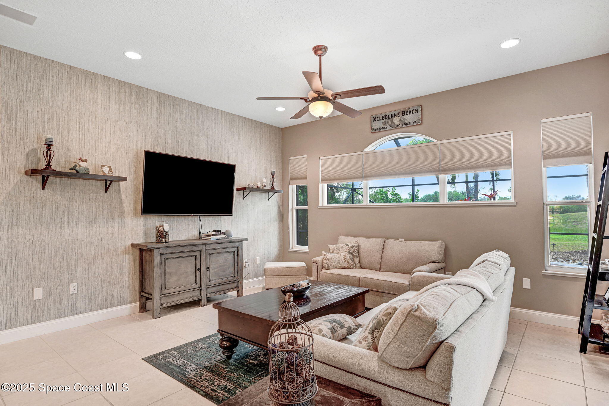 8082 Old Tramway Drive Melbourne, FL 32940 - Photo 29 of 82 a living room with furniture and a flat screen tv