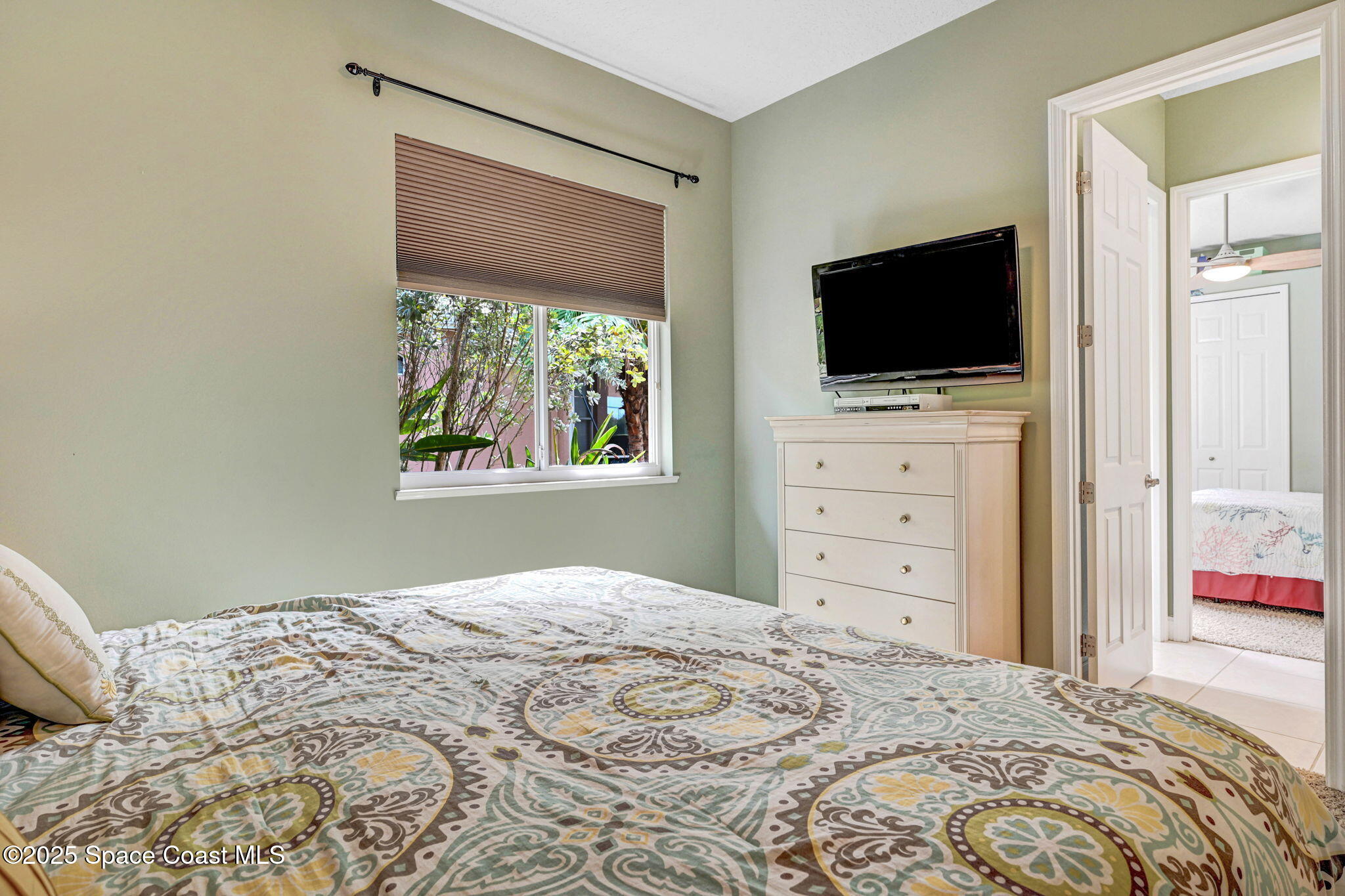 8082 Old Tramway Drive Melbourne, FL 32940 - Photo 36 of 82 a bedroom with a bed and a flat screen tv