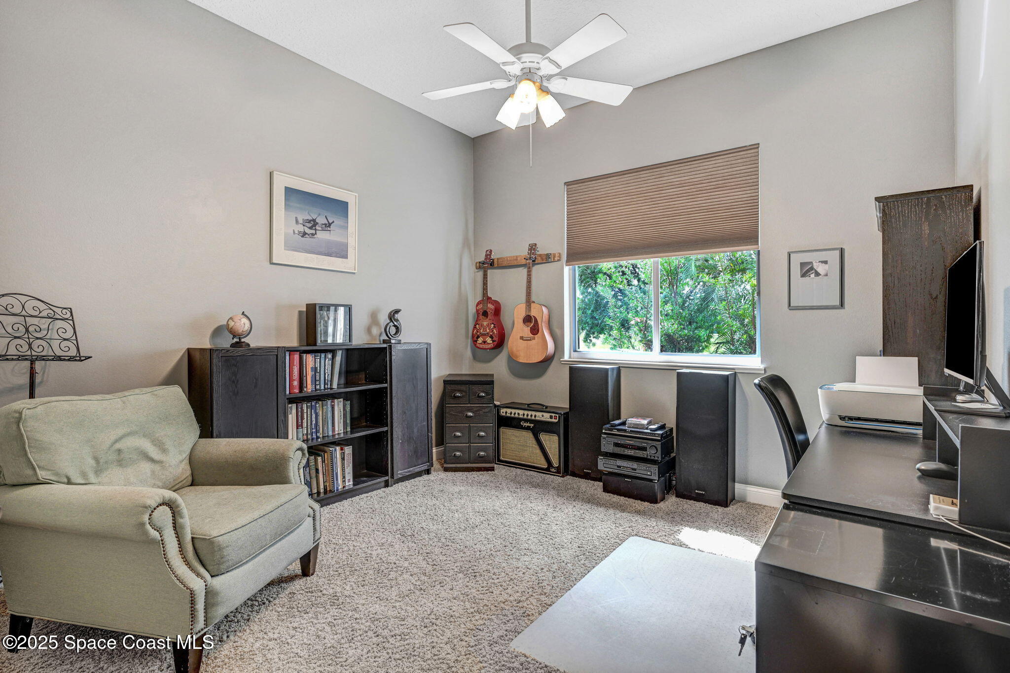 8082 Old Tramway Drive Melbourne, FL 32940 - Photo 41 of 82 a living room with furniture a flat screen tv and a window