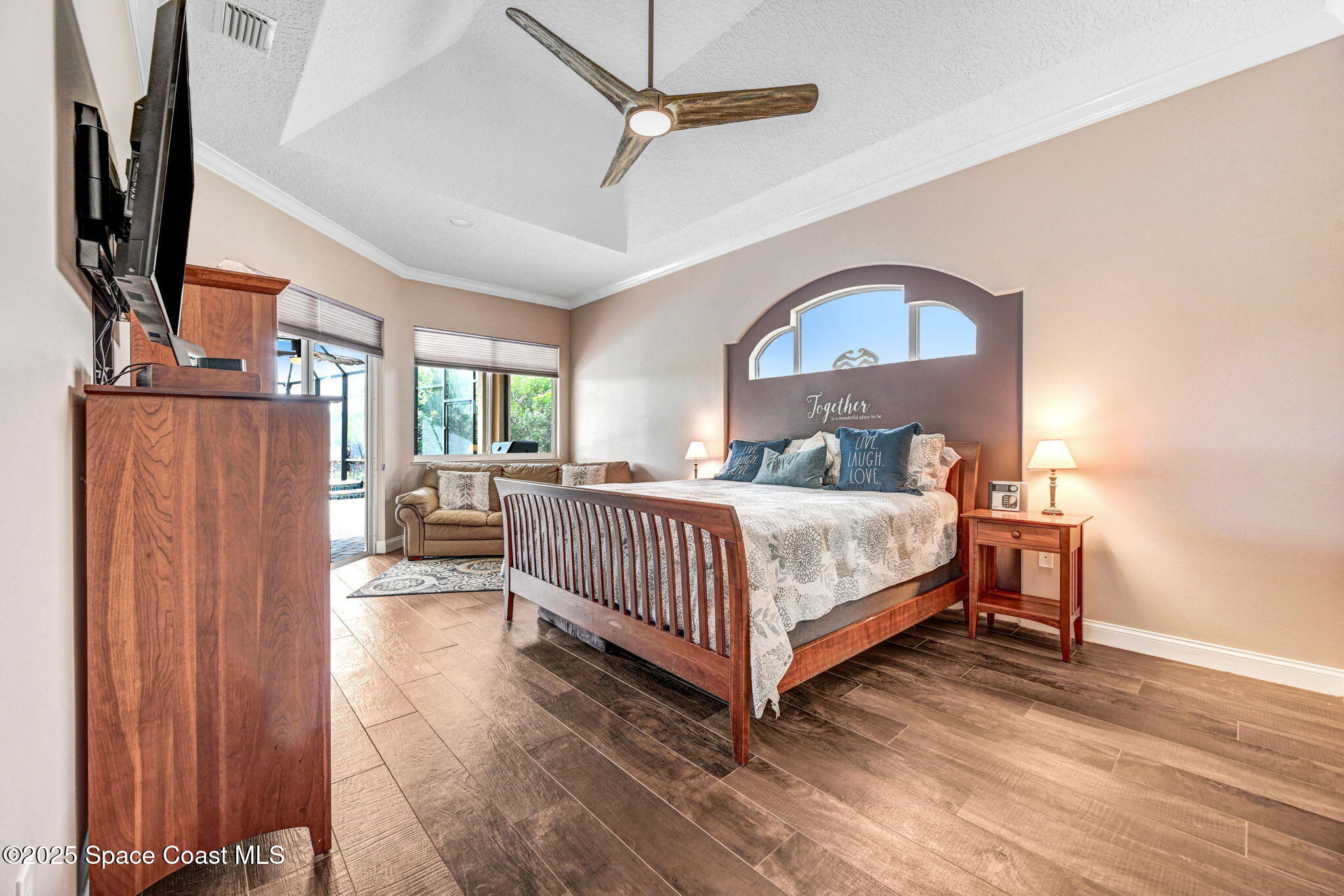 8082 Old Tramway Drive Melbourne, FL 32940 - Photo 44 of 82 a bedroom with a bed flat screen tv and a window