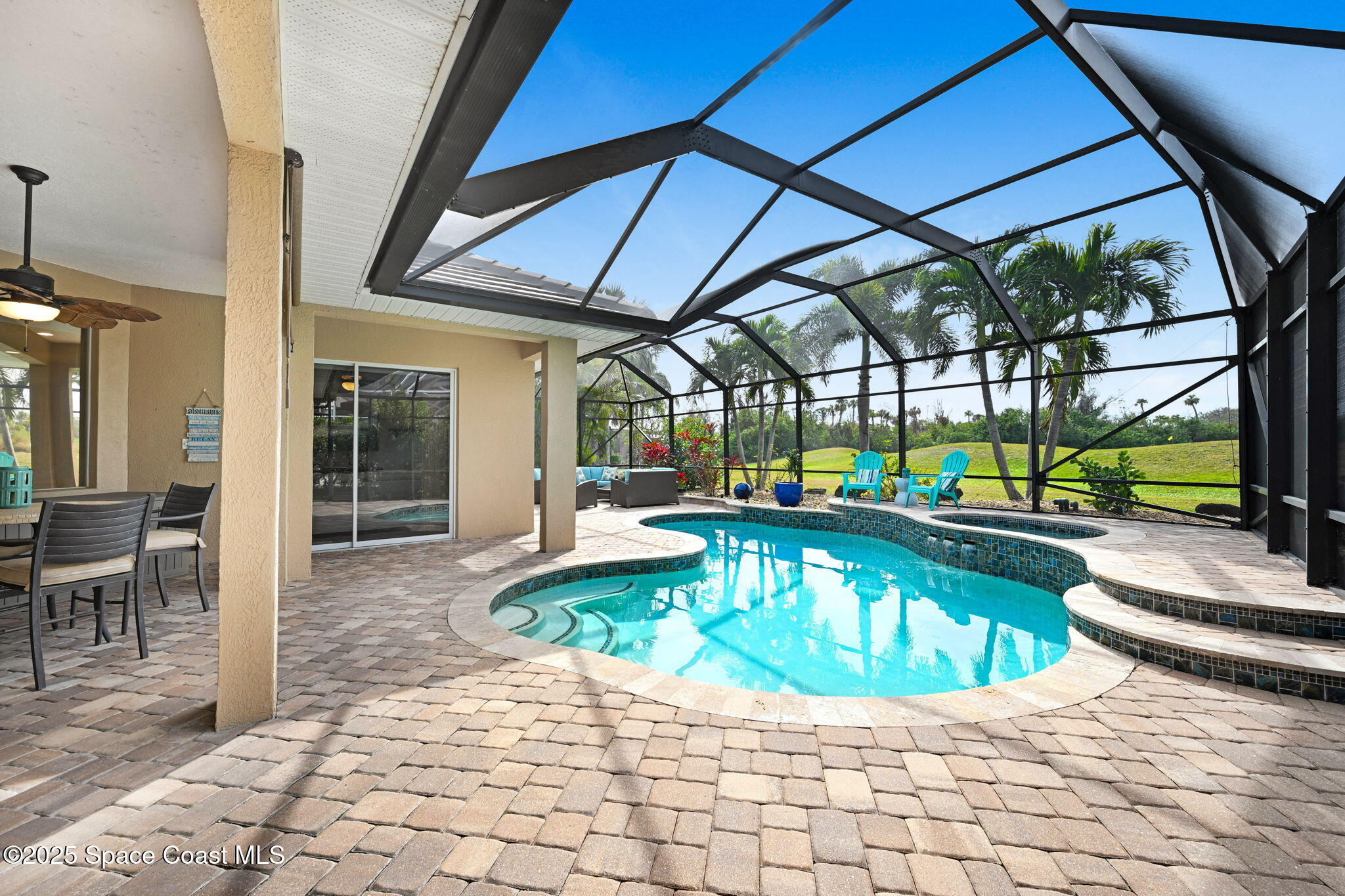 8082 Old Tramway Drive Melbourne, FL 32940 - Photo 57 of 82 a view of a swimming pool with a patio