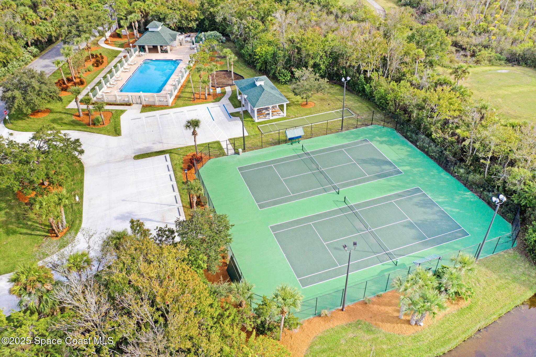 8082 Old Tramway Drive Melbourne, FL 32940 - Photo 75 of 82 an aerial view of a house with a yard and potted plants