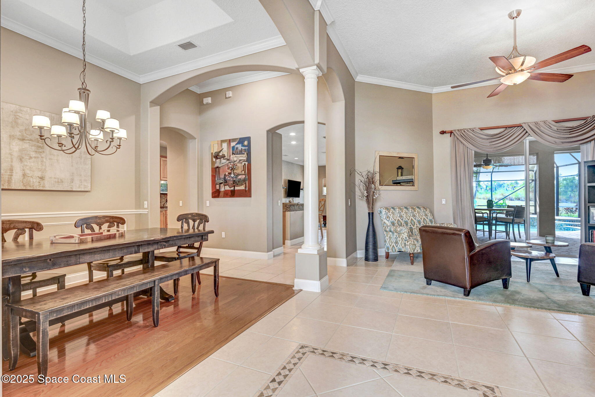 8082 Old Tramway Drive Melbourne, FL 32940 - Photo 8 of 82 a living room with couches a dining table and chairs with wooden floor