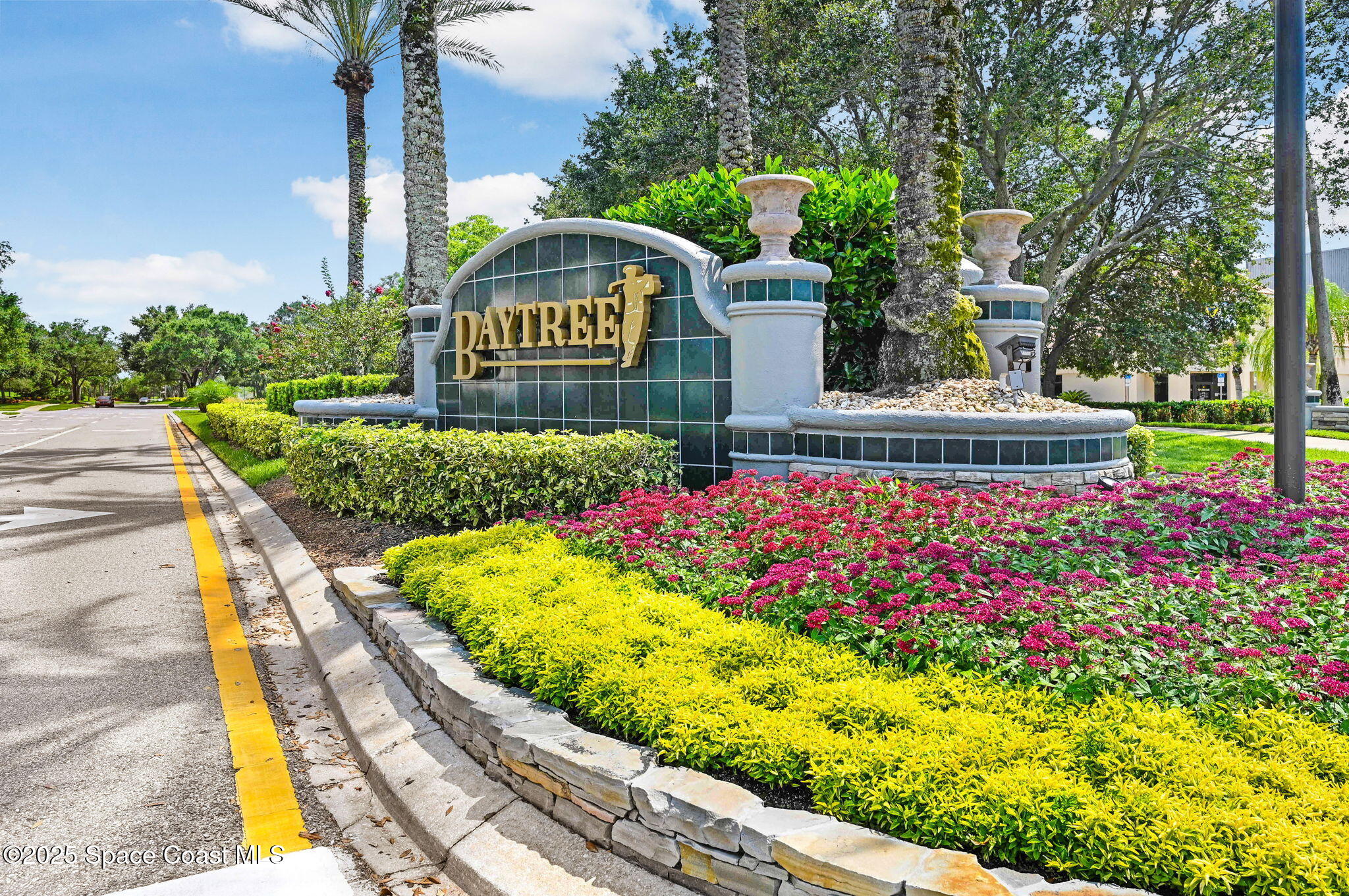 8082 Old Tramway Drive Melbourne, FL 32940 - Photo 82 of 82 a large sign that is sitting in front of flowers