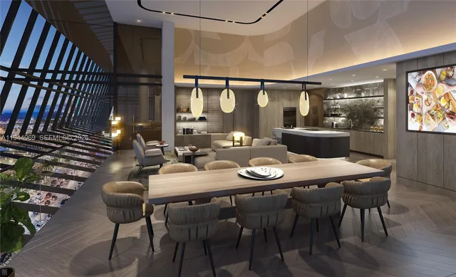 a living room with furniture flowerpot and kitchen view