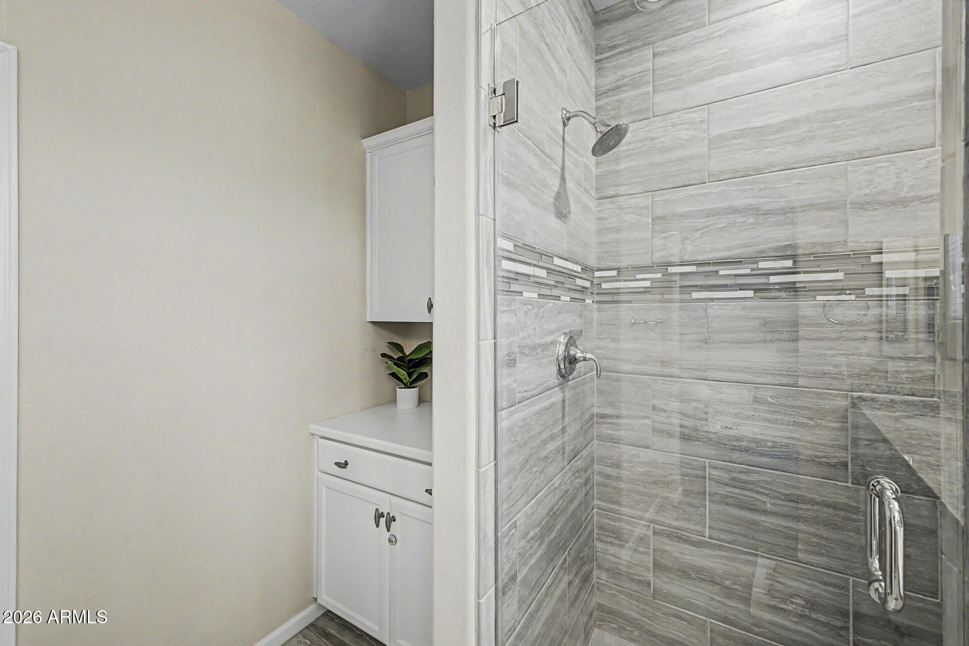 3935 East Rough Rider Road, Unit 1373 Phoenix, AZ 85050 - Photo 19 of 48 a bathroom with a shower and a sink
