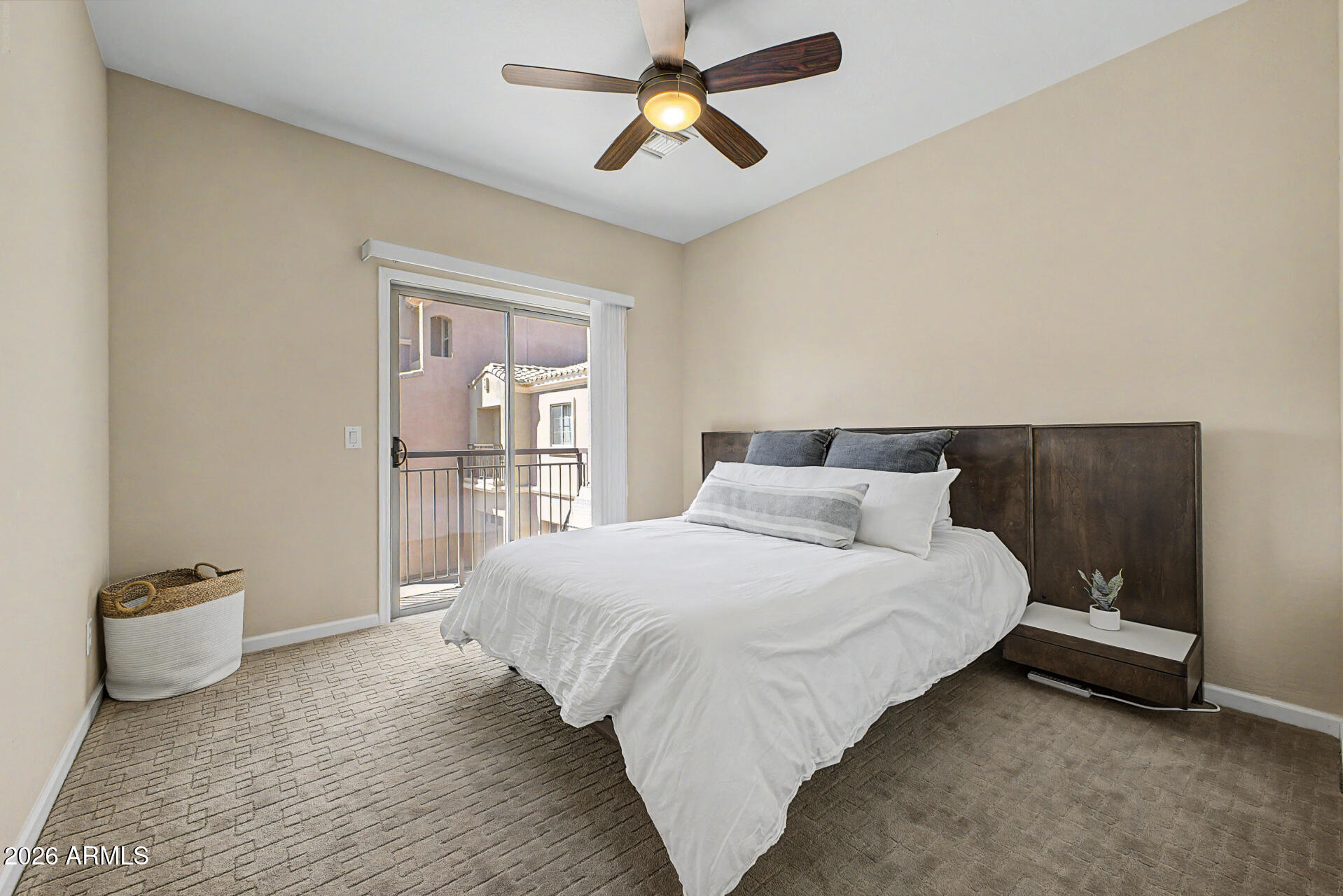 3935 East Rough Rider Road, Unit 1373 Phoenix, AZ 85050 - Photo 21 of 48 a bedroom with a bed and window