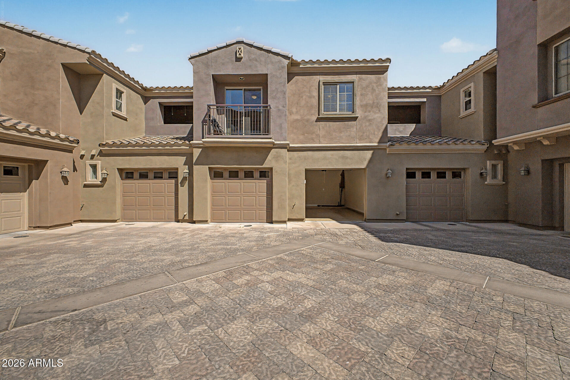 3935 East Rough Rider Road, Unit 1373 Phoenix, AZ 85050 - Photo 29 of 48 a front view of a house with a yard