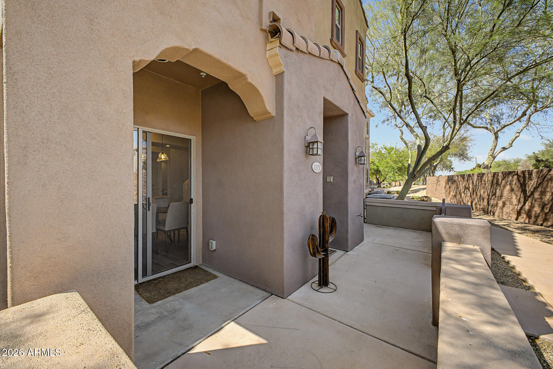 3935 East Rough Rider Road, Unit 1373 Phoenix, AZ 85050 - Photo 3 of 48 a view of a back yard of the house