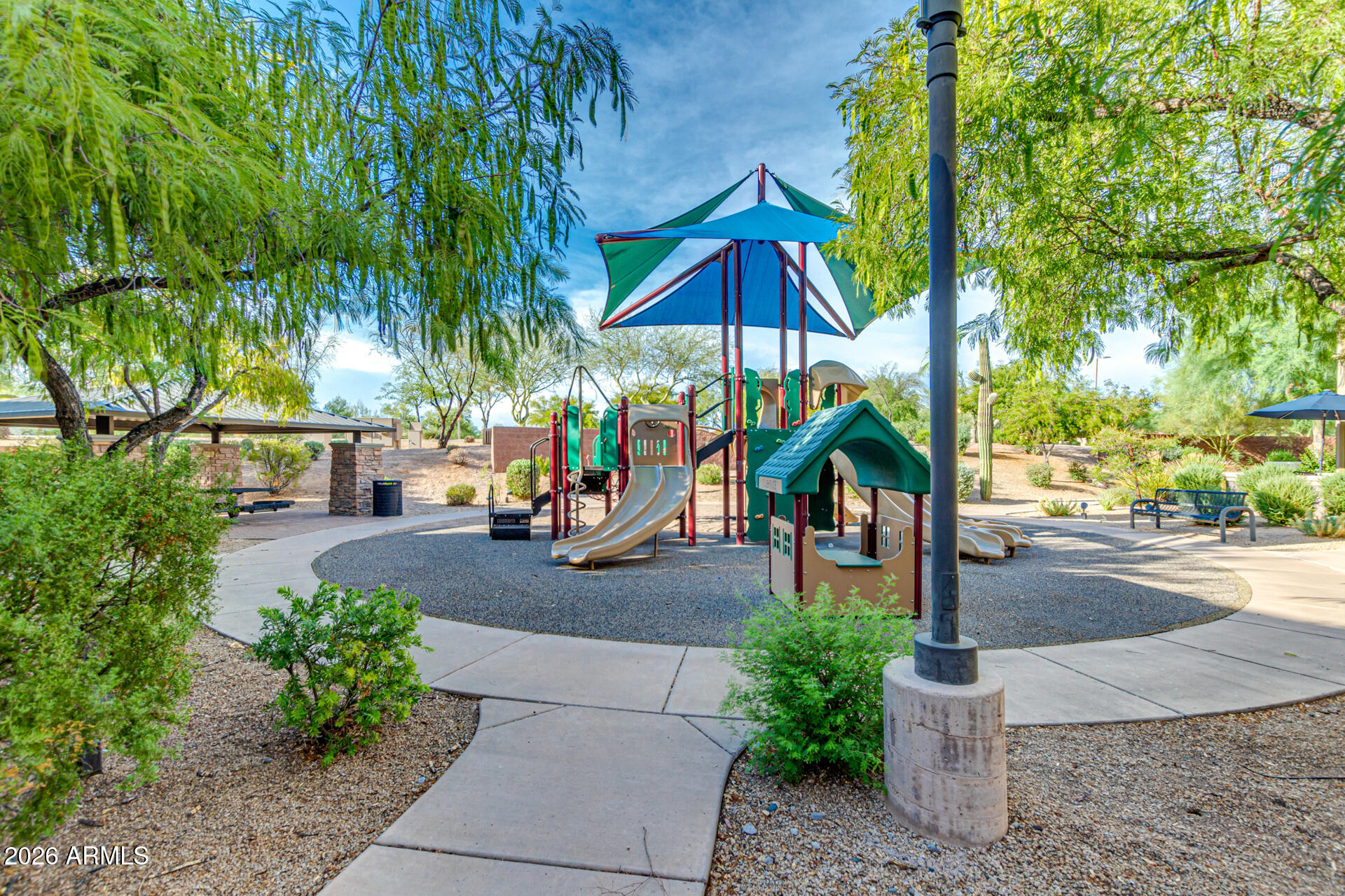 3935 East Rough Rider Road, Unit 1373 Phoenix, AZ 85050 - Photo 31 of 48 a view of street with sitting area