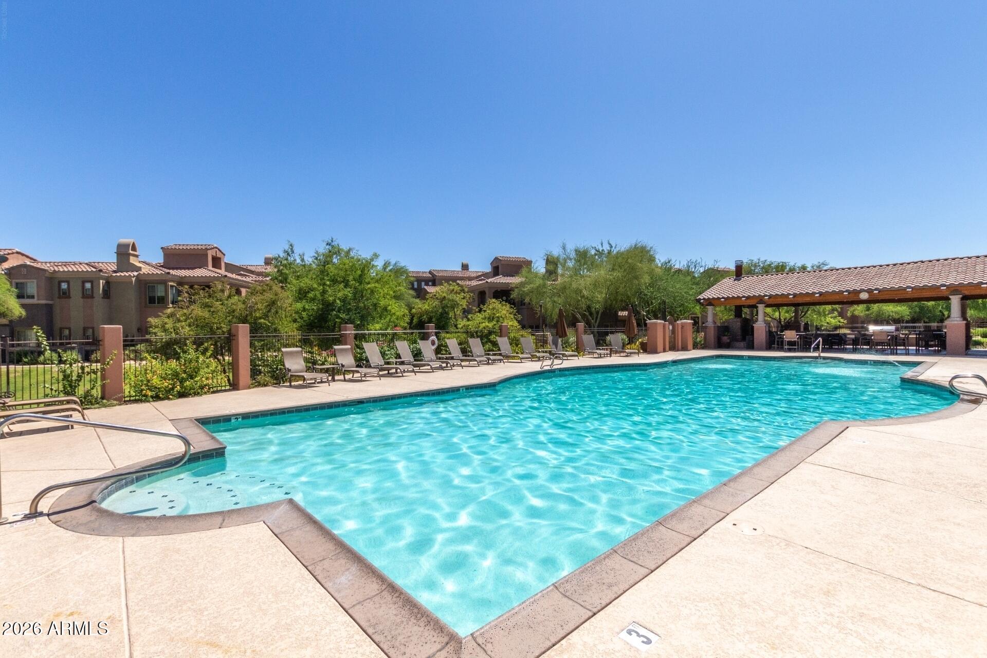 3935 East Rough Rider Road, Unit 1373 Phoenix, AZ 85050 - Photo 34 of 48 a view of a garden and basketball court