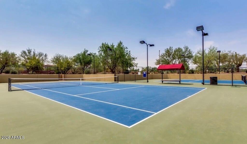 3935 East Rough Rider Road, Unit 1373 Phoenix, AZ 85050 - Photo 35 of 48 a view of a tennis court