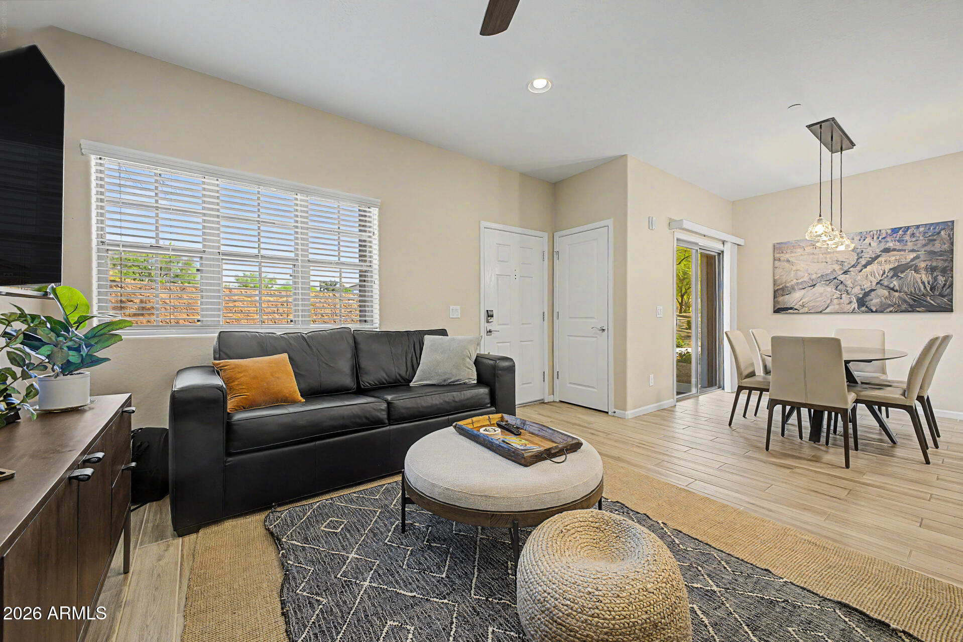 3935 East Rough Rider Road, Unit 1373 Phoenix, AZ 85050 - Photo 8 of 48 a living room with furniture and a large window