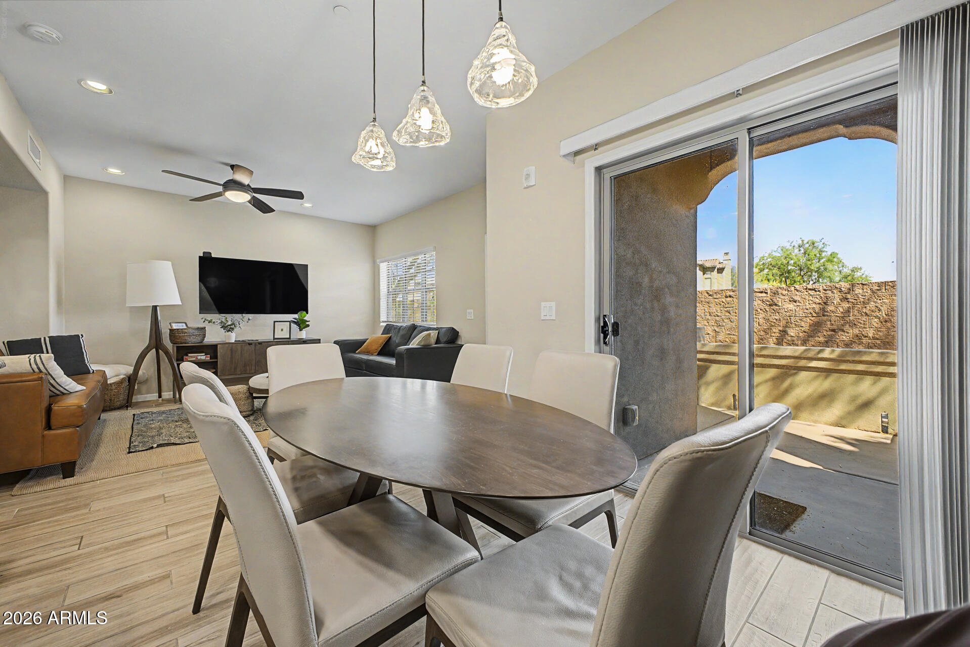3935 East Rough Rider Road, Unit 1373 Phoenix, AZ 85050 - Photo 10 of 48 a view of a dining room with furniture window and wooden floor