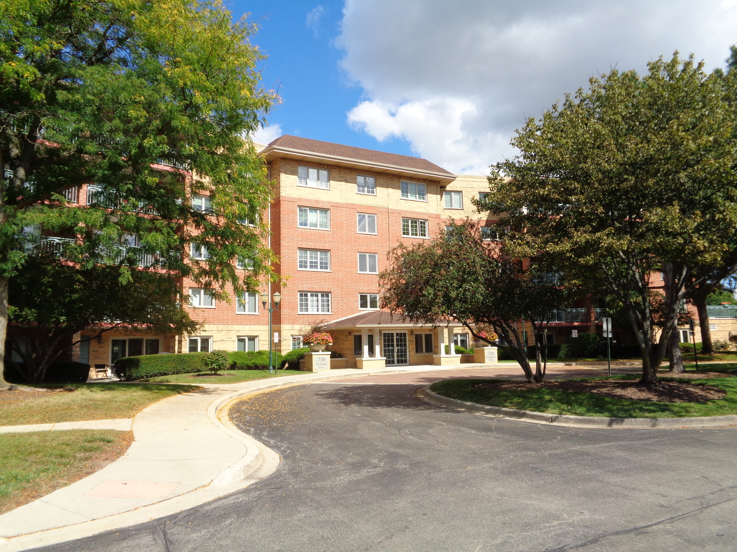 730 Creekside Drive, Unit 405C Mount Prospect, IL 60056 - Photo 31 of 34 a front view of a house with a yard