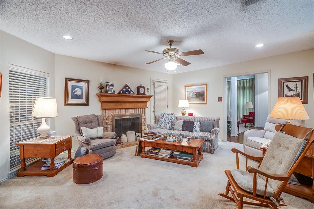 1086 Rock Ridge Drive Burleson, TX 76028 - Photo 19 of 40 a living room with furniture a fireplace and a window