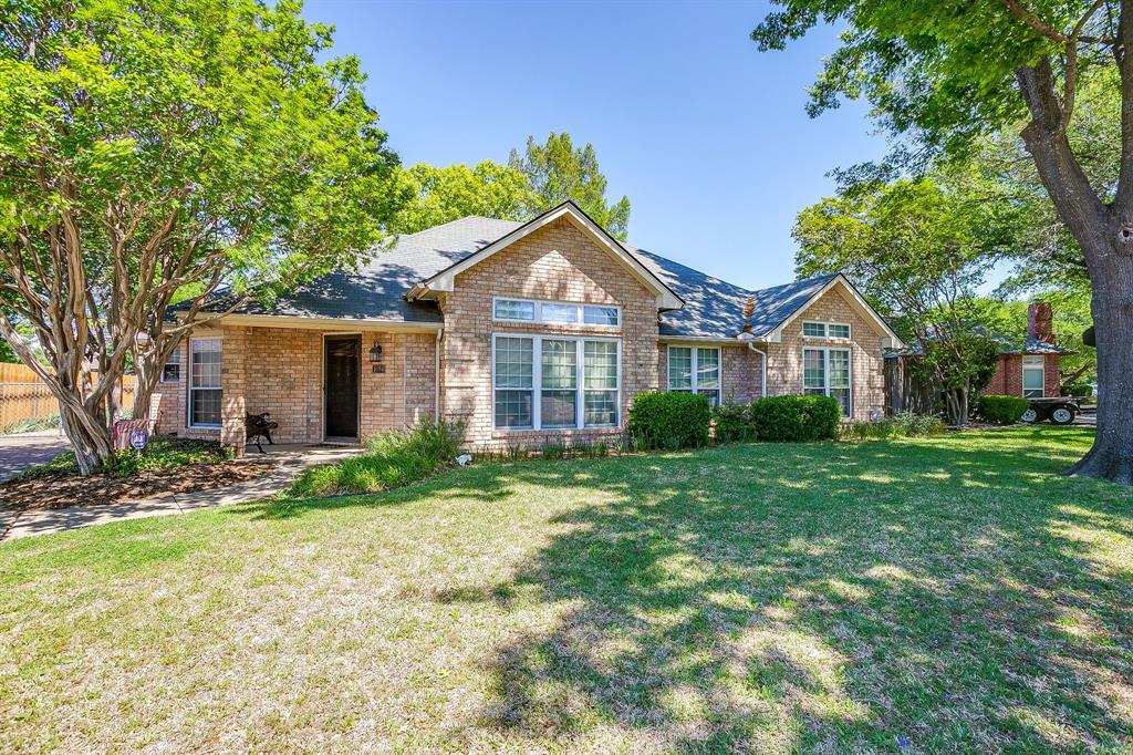 1086 Rock Ridge Drive Burleson, TX 76028 - Photo 2 of 40 a front view of a house with a yard and trees