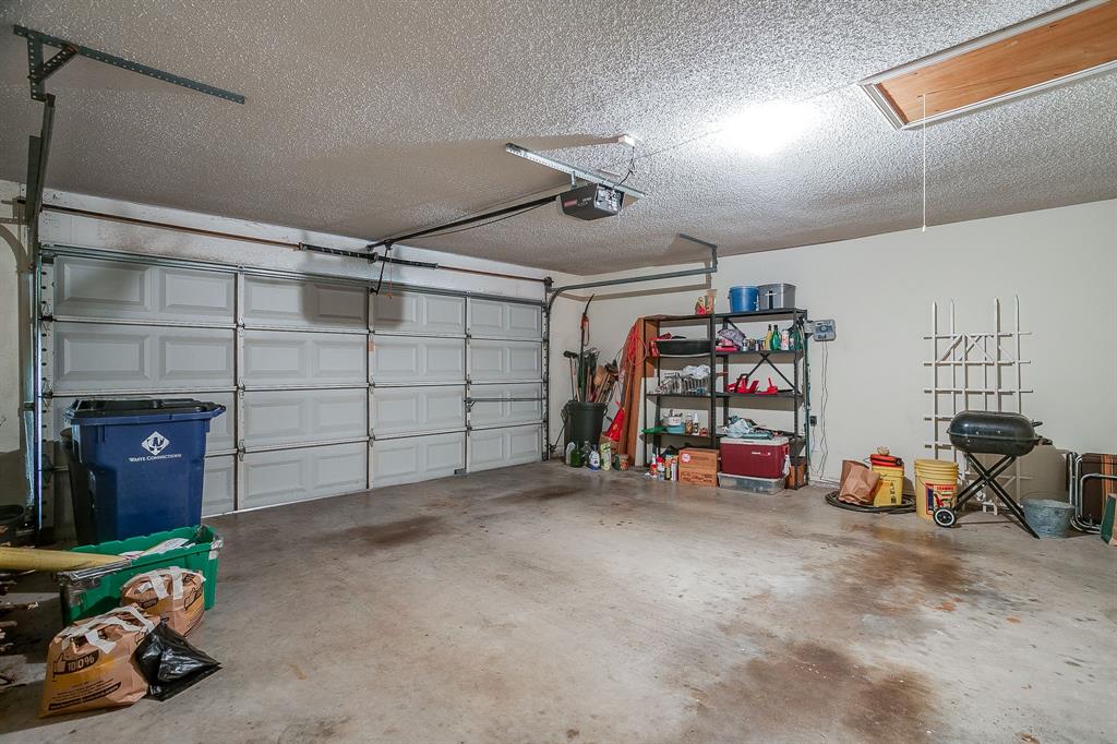 1086 Rock Ridge Drive Burleson, TX 76028 - Photo 34 of 40 a view of a garage with rack and bicycle