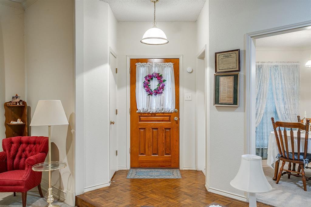 1086 Rock Ridge Drive Burleson, TX 76028 - Photo 5 of 40 a view of hallway with furniture and wooden floor
