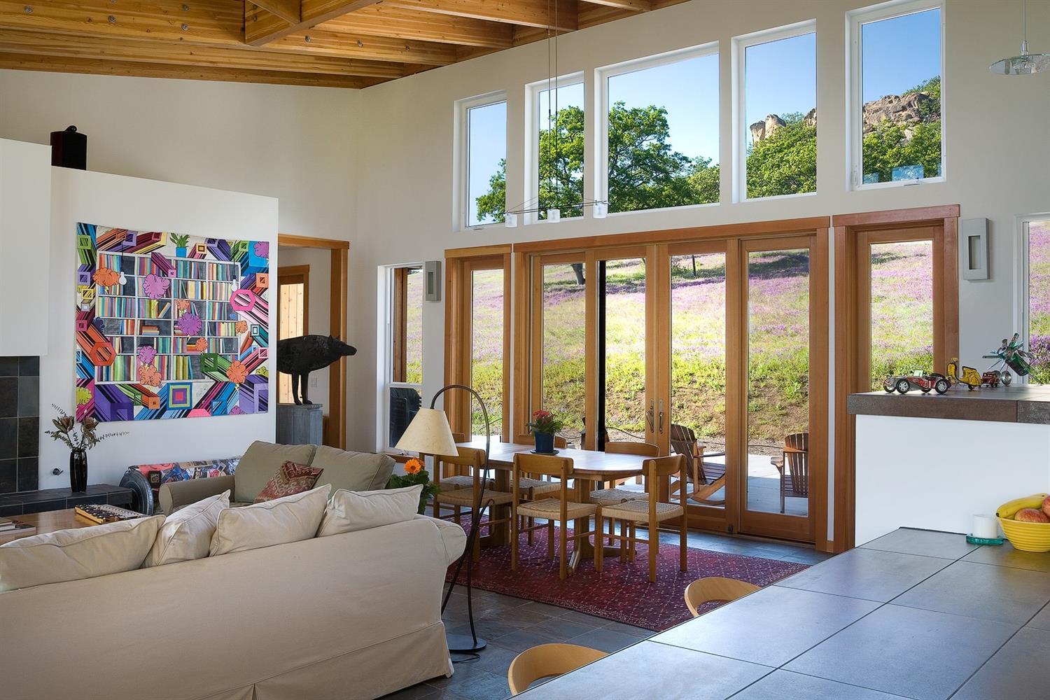 2645 Butler Creek Road Ashland, OR 97520 - Photo 5 of 17 a living room with furniture and a floor to ceiling window