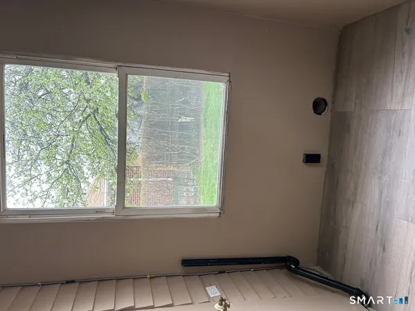 a view of a room that has a window in it