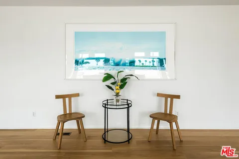 a view of balcony with wooden floor