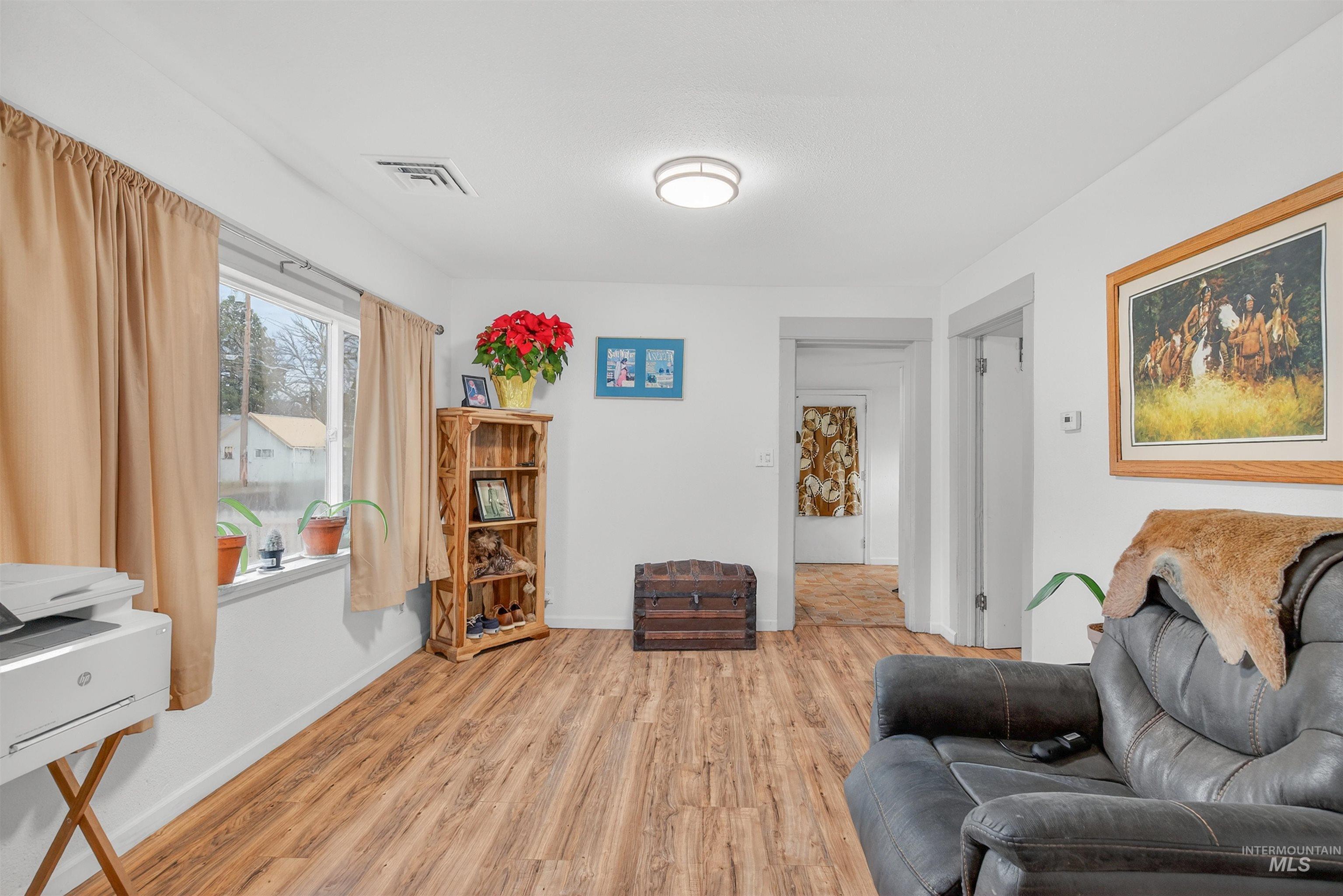 601 12th Street Clarkston, WA 99403 - Photo 8 of 21 Living room featuring light wood-type flooring and baseboards