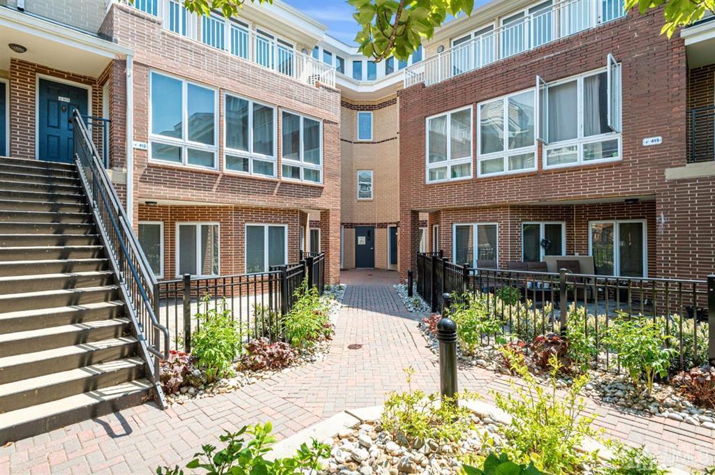 368 Rector Street, Unit 514 Perth Amboy, NJ 08861 - Photo 1 of 24 a front view of a house with a garden